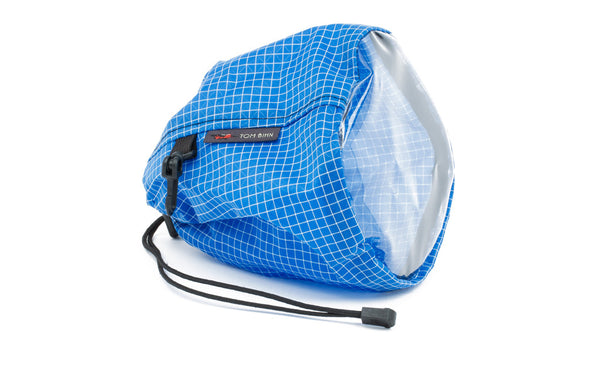 A medium, clear-bottom Yarn Stuff Sack in Island (blue with white grid) 200 Halcyon.